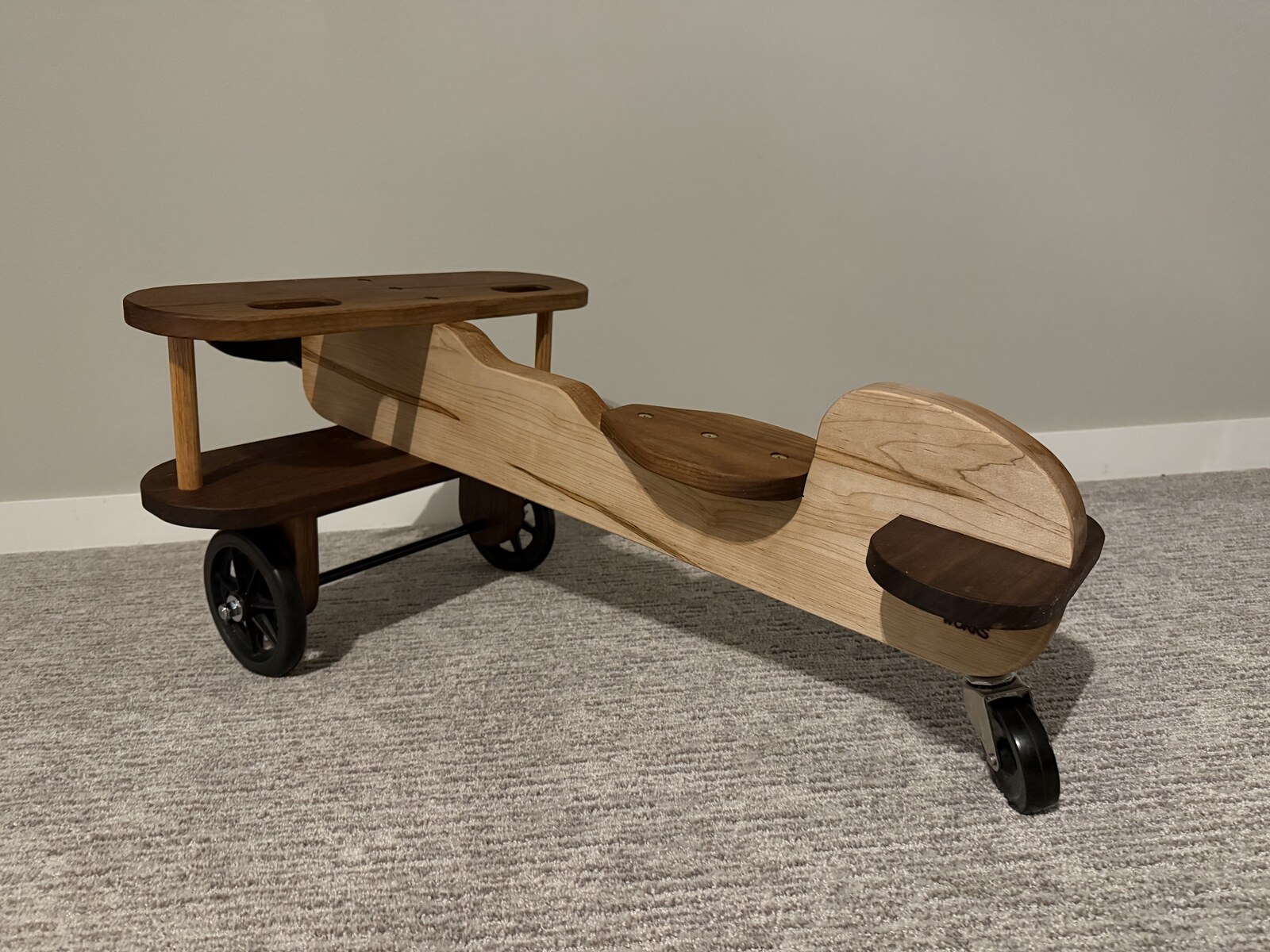 Wooden airplane toy side view showing full wingspan