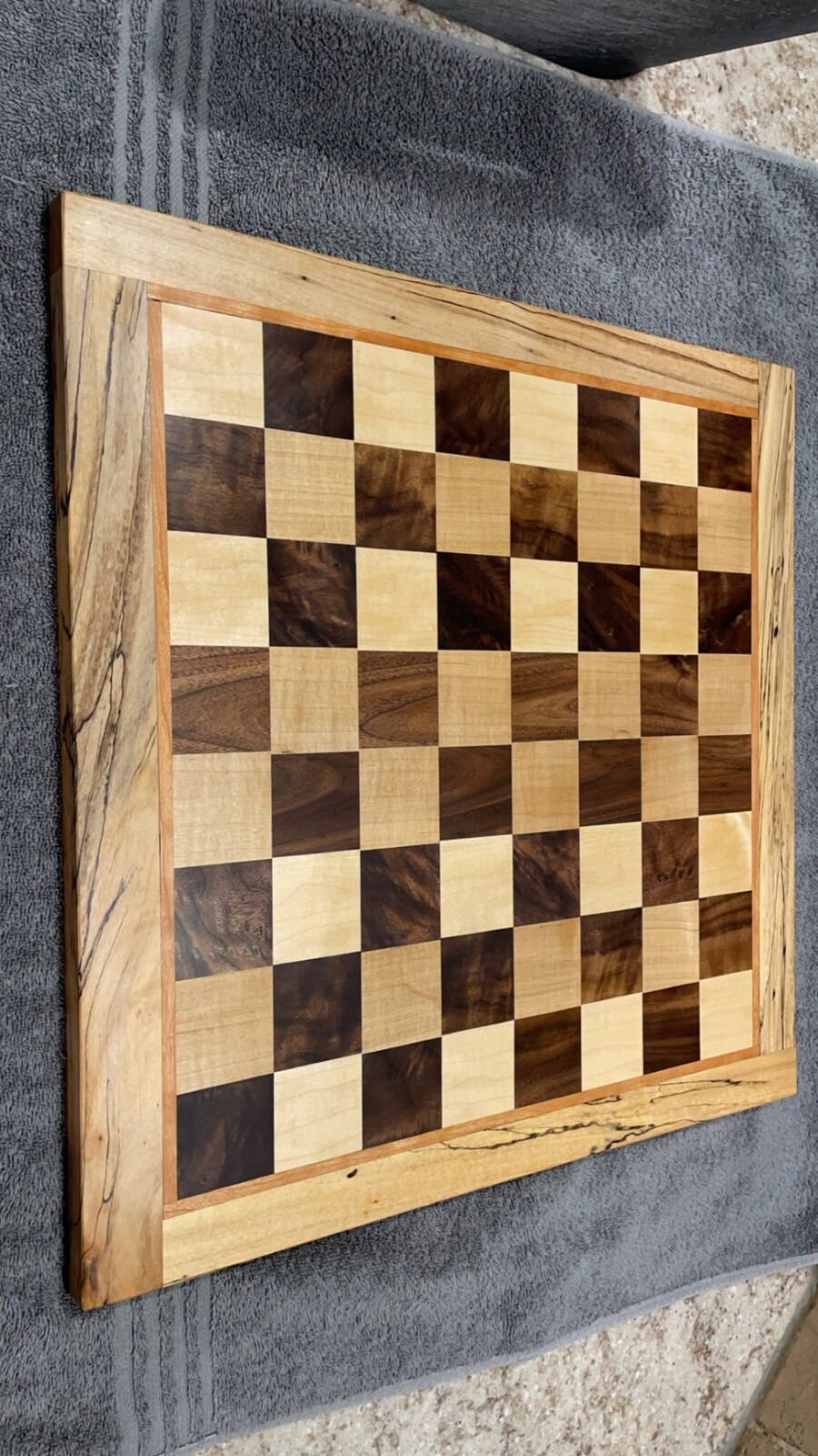 Walnut and maple chess board with live-edge spalted maple border